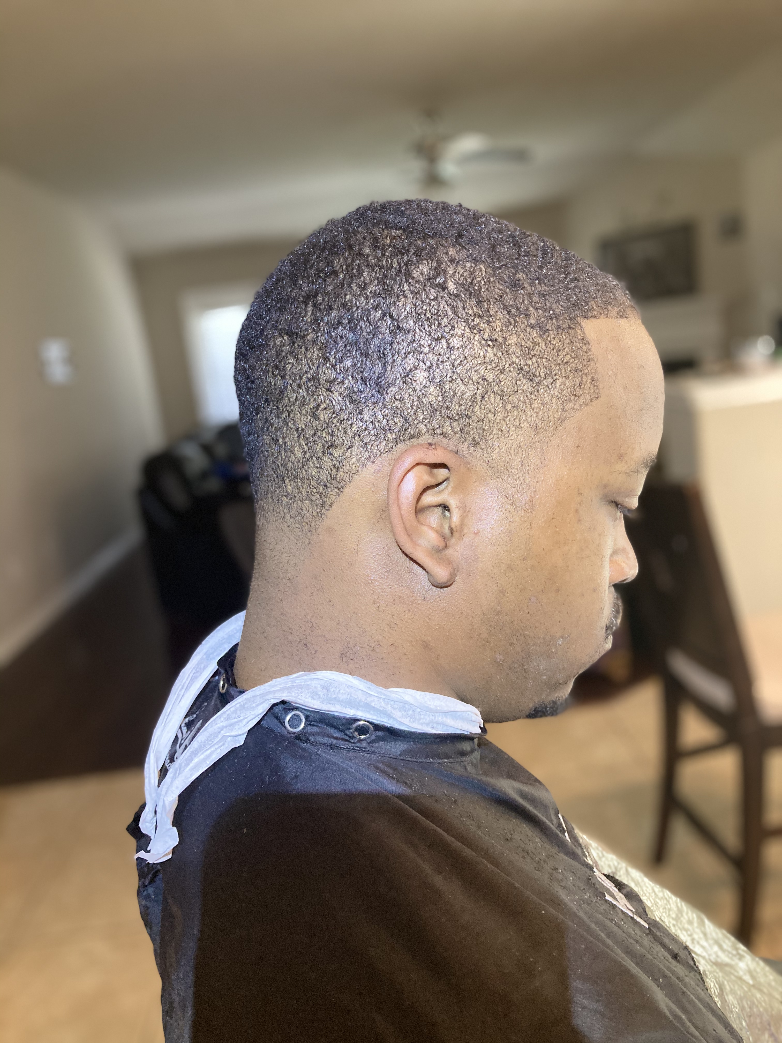Highlight Clips mobile barber at work on a client's haircut